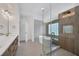 Open and airy bathroom with modern shower and standalone tub, offering a seamless design for a spa-like experience at 16317 Colwood Dr, Odessa, FL 33556