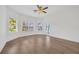 Spacious bedroom filled with natural light from multiple windows, featuring sleek flooring at 16317 Colwood Dr, Odessa, FL 33556