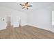 Spacious bedroom filled with natural light from multiple windows, featuring sleek flooring at 16317 Colwood Dr, Odessa, FL 33556