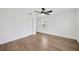 This bright bedroom offers wood flooring, a ceiling fan, and a closet at 16317 Colwood Dr, Odessa, FL 33556