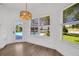 Bright breakfast nook featuring a view of the pool and manicured backyard at 16317 Colwood Dr, Odessa, FL 33556