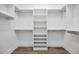 Walk-in closet with shelving, designed for organized storage and easy access to your wardrobe essentials at 16317 Colwood Dr, Odessa, FL 33556