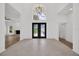 Bright foyer with high ceilings, double doors, and views to the living room at 16317 Colwood Dr, Odessa, FL 33556