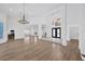 Open-concept living room boasts hardwood floors, recessed lights, and soaring ceilings at 16317 Colwood Dr, Odessa, FL 33556
