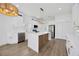 Spacious white kitchen with a large island, stainless appliances, and sleek countertops at 16317 Colwood Dr, Odessa, FL 33556