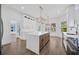 Bright kitchen boasts white cabinetry, a spacious island, modern appliances, and scenic views at 16317 Colwood Dr, Odessa, FL 33556