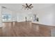 Large living space with light wood flooring and views of backyard and exterior at 16317 Colwood Dr, Odessa, FL 33556