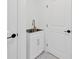 Practical mud room featuring cabinet sink, designed for convenience and organization near entryways at 16317 Colwood Dr, Odessa, FL 33556