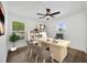 Home office space with modern desk, stylish décor, and bright windows at 16317 Colwood Dr, Odessa, FL 33556