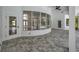 Bright and airy outdoor patio with tile flooring, large windows, and access to the pool at 16317 Colwood Dr, Odessa, FL 33556