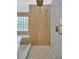 Beautiful shower with rainfall shower head, pebble floor, and glass block window at 16317 Colwood Dr, Odessa, FL 33556