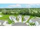 Aerial view of several homes in a community surrounded by lush greenery and natural beauty at 1680 Hazy Sea Dr, Plant City, FL 33565