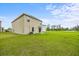 Sprawling backyard with a lush lawn, offering ample space for outdoor entertainment and recreation at 1680 Hazy Sea Dr, Plant City, FL 33565