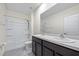 Well-lit bathroom featuring a shower-tub combo, dual sinks, and modern fixtures at 1680 Hazy Sea Dr, Plant City, FL 33565