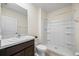 Bathroom showcasing a walk-in shower, tile flooring, and vanity sink at 1680 Hazy Sea Dr, Plant City, FL 33565