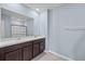 Bathroom showcasing double sinks, a large mirror, and a shower-tub combo at 1680 Hazy Sea Dr, Plant City, FL 33565