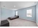 Bedroom featuring carpet, two windows and light blue paint at 1680 Hazy Sea Dr, Plant City, FL 33565