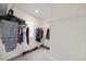 Walk-in closet with shelving and hanging storage for clothes and shoes at 1680 Hazy Sea Dr, Plant City, FL 33565