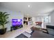 Open concept space with TV, an island with barstool seating, and a pool table at 1680 Hazy Sea Dr, Plant City, FL 33565