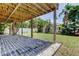 Inviting backyard featuring a stone patio, a lush lawn, and tropical landscaping, perfect for outdoor relaxation at 1858 Michigan Ne Ave, St Petersburg, FL 33703