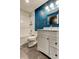 Bathroom featuring a white vanity and toilet, shower/tub and decorative wall decals at 1858 Michigan Ne Ave, St Petersburg, FL 33703