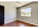 Bedroom with natural lighting coming in through a window and hardwood floors at 1858 Michigan Ne Ave, St Petersburg, FL 33703