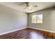 This room features hardwood floors, a window offering natural light, and a ceiling fan at 1858 Michigan Ne Ave, St Petersburg, FL 33703