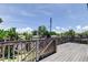 Spacious wooden deck with wooden railing offers an outdoor space for enjoyment and relaxation at 1858 Michigan Ne Ave, St Petersburg, FL 33703