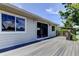 A newly-built deck showcases a sliding glass door entrance offering tranquil outdoor living and entertaining space at 1858 Michigan Ne Ave, St Petersburg, FL 33703