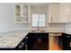 Bright kitchen with granite countertops, stainless steel appliances and new white cabinets at 1858 Michigan Ne Ave, St Petersburg, FL 33703