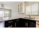 Modern kitchen with stainless appliances, granite counters, and new white cabinets at 1858 Michigan Ne Ave, St Petersburg, FL 33703