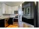 Bright kitchen featuring stainless steel appliances and white cabinets at 1858 Michigan Ne Ave, St Petersburg, FL 33703
