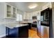 Updated kitchen with stainless steel appliances, subway tile backsplash, and island at 1858 Michigan Ne Ave, St Petersburg, FL 33703