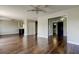 Open living room featuring wood floors, ceiling fans, and access to other rooms at 1858 Michigan Ne Ave, St Petersburg, FL 33703