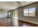Spacious living room boasts wood floors and sliding glass doors to a wooden deck at 1858 Michigan Ne Ave, St Petersburg, FL 33703