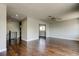 Open living room with wood floors, ceiling fan, and stair access at 1858 Michigan Ne Ave, St Petersburg, FL 33703