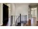 Interior view showcasing a black spiral staircase leading to the second story landing at 1858 Michigan Ne Ave, St Petersburg, FL 33703
