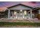 Charming single-story home with a welcoming front porch and a well-maintained lawn under an expressive sky at 1902 N Tampania Ave, Tampa, FL 33607