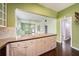 Stylish kitchen island with granite countertops, storage and view into the living space at 1902 N Tampania Ave, Tampa, FL 33607