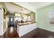 The beautifully designed kitchen is equipped with stainless steel appliances and white cabinets at 1902 N Tampania Ave, Tampa, FL 33607
