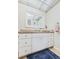 Bathroom with a vanity, well-lit mirror, and decorative accents on the counter at 19029 Us Highway 19 N # 3-1, Clearwater, FL 33764