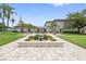 Well-maintained property boasting tropical landscaping, a welcoming entrance, and a lush lawn at 19029 Us Highway 19 N # 3-1, Clearwater, FL 33764
