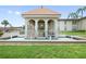 Beautiful gazebo with tile roof and ornate columns, surrounded by a refreshing fountain at 19029 Us Highway 19 N # 3-1, Clearwater, FL 33764