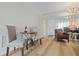 Cozy breakfast nook in the living room with wood floors and neutral decor at 19029 Us Highway 19 N # 3-1, Clearwater, FL 33764