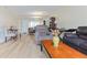 Bright living room featuring a large mirror wall that makes the space feel open and airy at 19029 Us Highway 19 N # 3-1, Clearwater, FL 33764