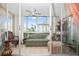 Relaxing sunroom filled with lots of natural light and charming furnishings at 19029 Us Highway 19 N # 3-1, Clearwater, FL 33764