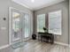 Bright breakfast nook with access to the pool area through French doors and large windows at 1958 Marshberry Ct, Trinity, FL 34655