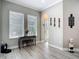 Dining area with views of the backyard through two large windows and modern decor at 1958 Marshberry Ct, Trinity, FL 34655