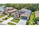 Aerial shot of a beautiful home with a well-maintained front yard in a serene neighborhood at 1958 Marshberry Ct, Trinity, FL 34655