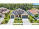Charming single-Gathering home featuring a manicured front yard and a two-car garage at 1958 Marshberry Ct, Trinity, FL 34655